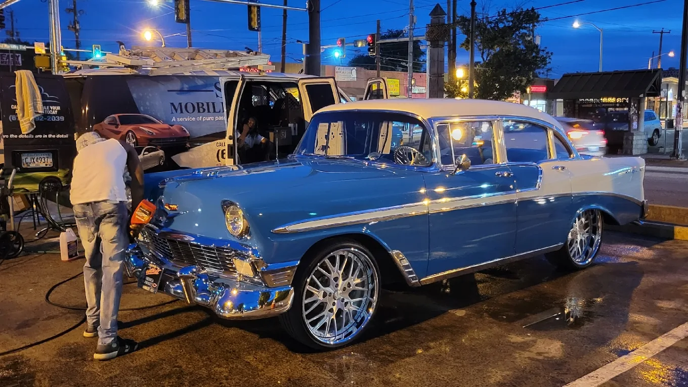 1956 Chevrolet Bel Air being hand-detailed at dusk in Atlanta
